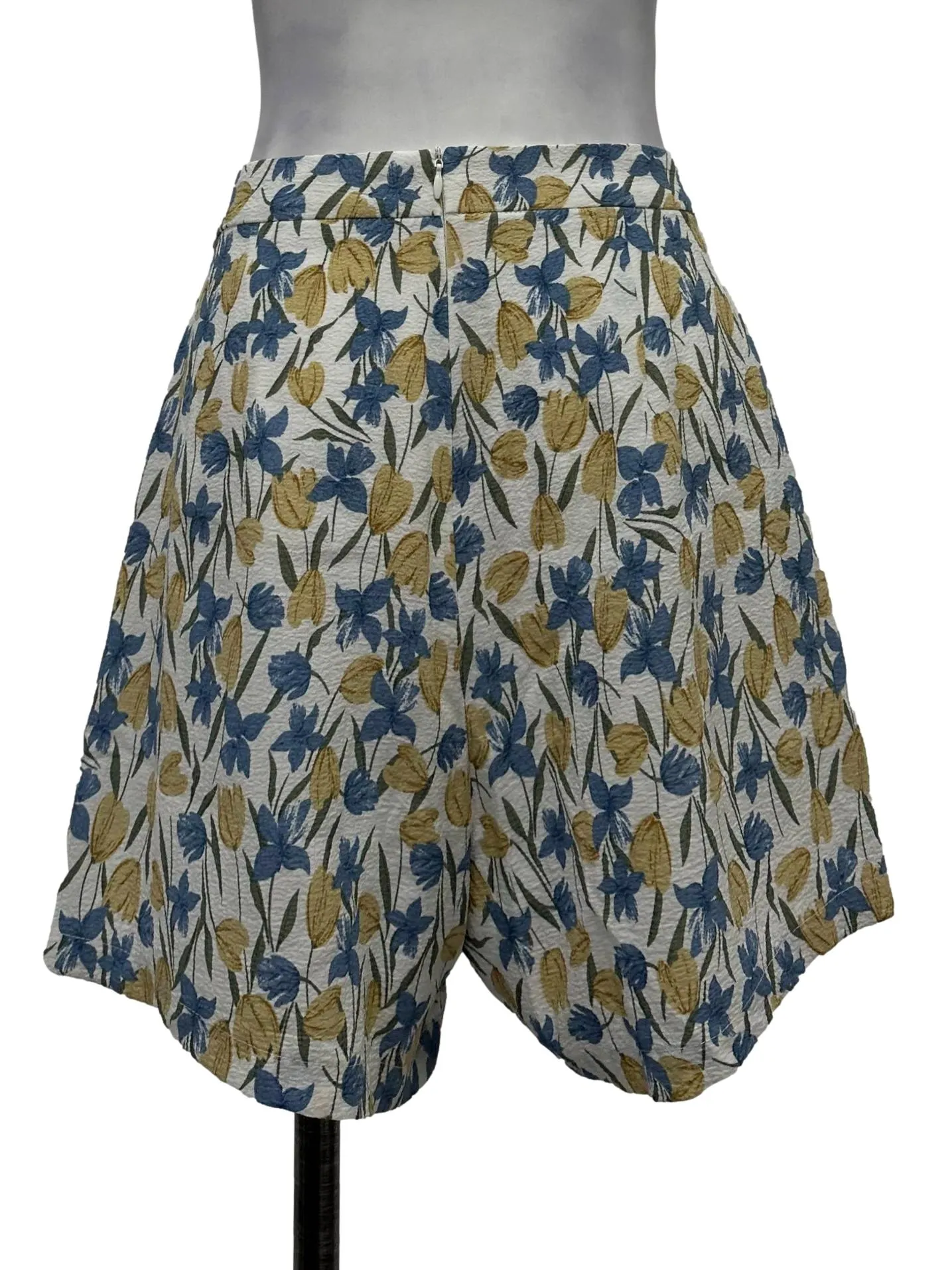 White Textured Shorts With Blue And Yellow Floral